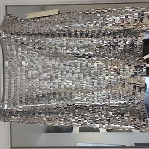 Sexy sequence, silver mini skirt, fully lined side zipper.